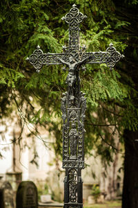 Low angle view of cross at cemetery