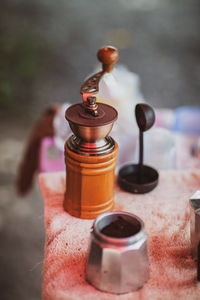 Close-up of small glass bottle on table