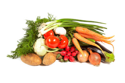 Vegetables on plate against white background