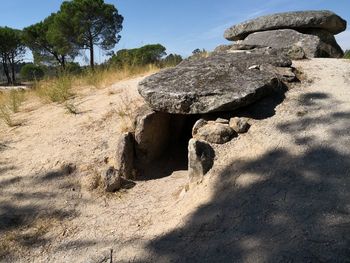 Rock formation on land against sky