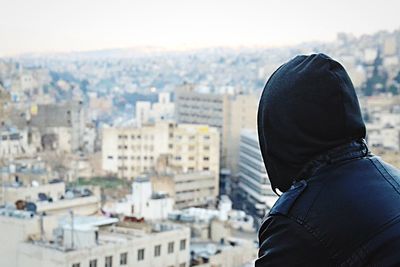 Woman looking at cityscape