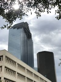 Low angle view of modern buildings against sky in city