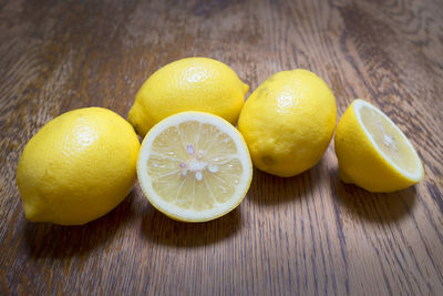 Close-up of yellow lemons on table