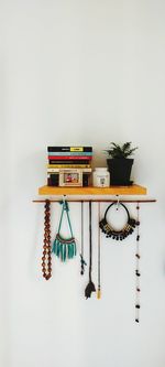 Decoration with books on table against wall at home