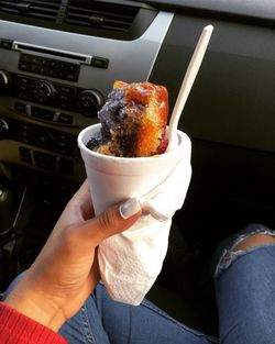 Close-up of hand holding ice cream