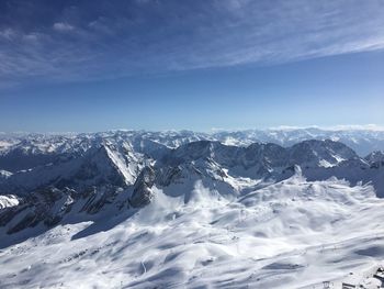 Scenic view of snowcapped mountains against sky