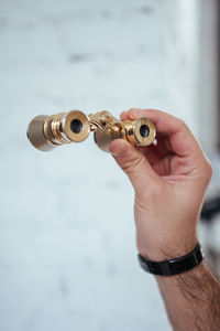 Cropped hand of person holding fidget spinner