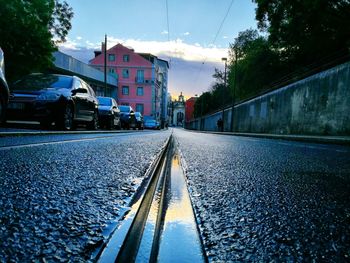 Railroad tracks in city against clear sky