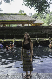 Portrait of woman standing in water