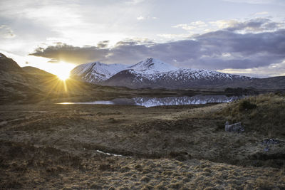 Scenic view of snowcapped mountains against sky during winter