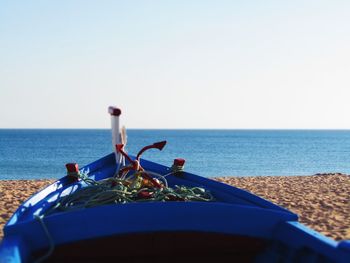 Close-up of sea against clear blue sky