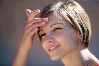 Close-up portrait of a smiling young woman