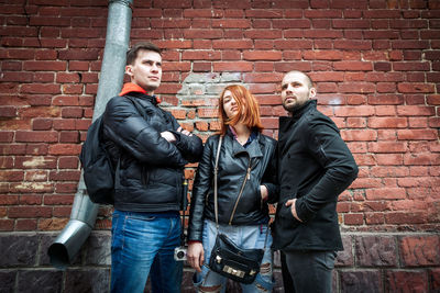 Fashionable shooting. 2 guys and a girl. city tourists