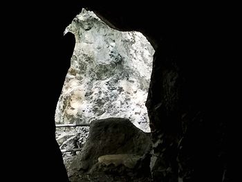 Close-up of rock against black background