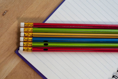 High angle view of multi colored pencils on table