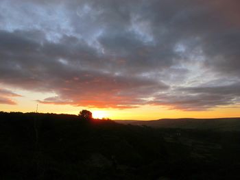 Scenic view of silhouette trees against sky during sunset