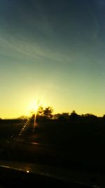 Scenic view of landscape against sky at sunset