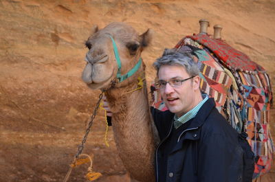 Portrait of man with camel