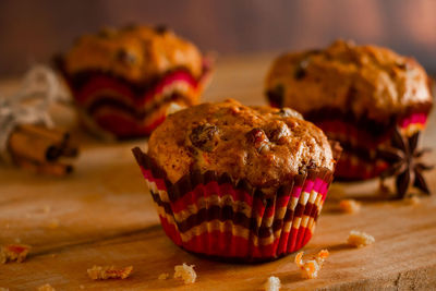 Appetizing homemade muffins on a wooden cutting board. traditional festive christmas baking.