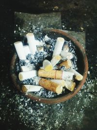 High angle view of cigarette in container