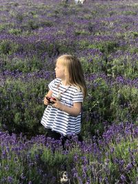 Little girl walking in the lavender fields