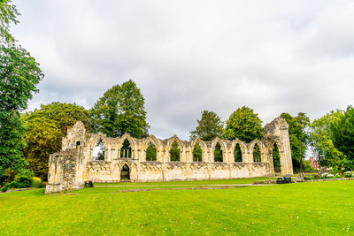 Old ruin building against cloudy sky