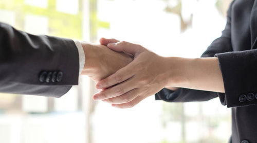 Close-up of business colleagues shaking hands