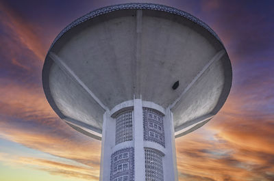 Low angle view of lighthouse against sky during sunset