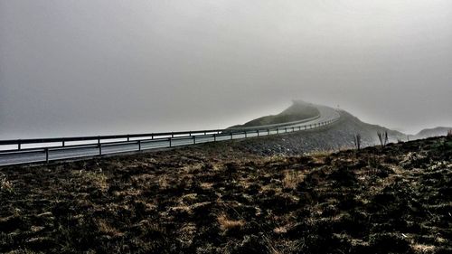 Panoramic view of bridge and mountains against sky