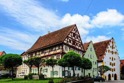 Exterior of building by street against sky