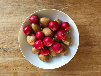 High angle view of strawberries in bowl on table