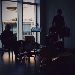 Two people sitting in restaurant