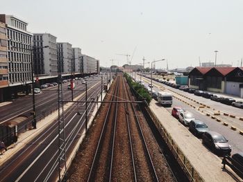 High angle view of railroad tracks amidst street in city