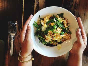 Cropped image of woman eating food