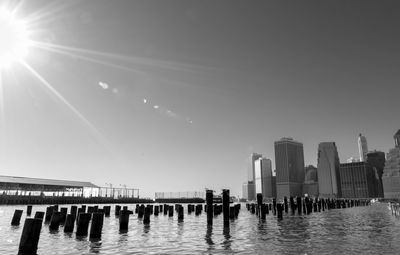 Sunburst over the east river and lower manhattan in black and white.