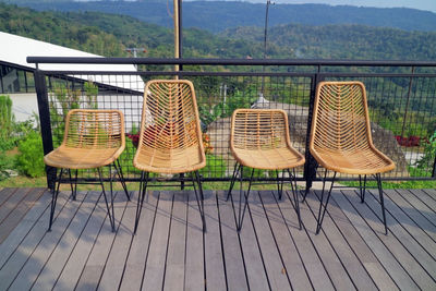 Four chairs made of woven wood photo