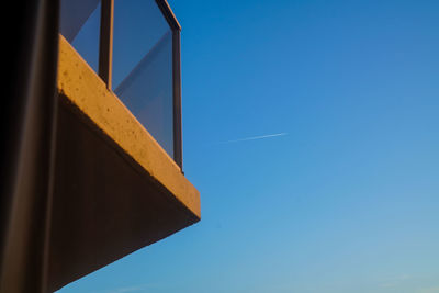 Low angle view of building against clear blue sky