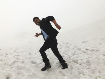 Full length of man standing on snow