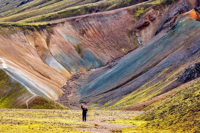 Woman standing on rock