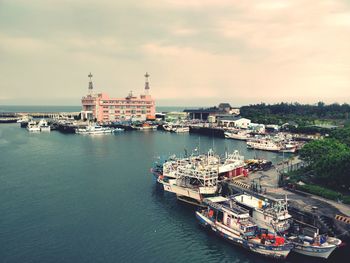 High angle view of harbor by sea against sky