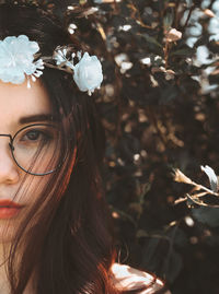 Portrait of woman with pink flowers