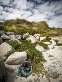 View of rock formation on land against sky