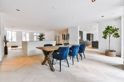 Empty chairs and table against wall at home