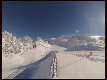 Scenic view of snow covered mountains