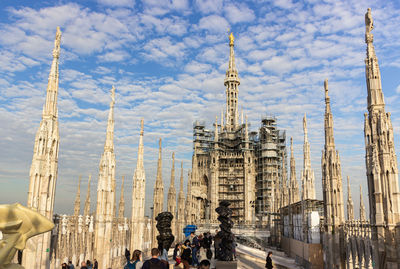 Panoramic view of buildings in city against sky