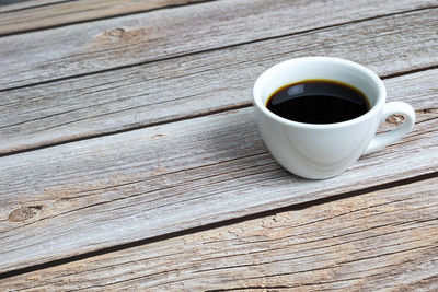 High angle view of coffee cup on table