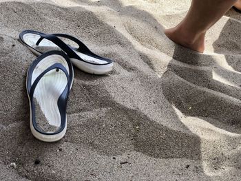 Low section of person on sand