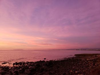 Scenic view of sea against sky at sunset