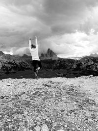 Man on mountain against sky