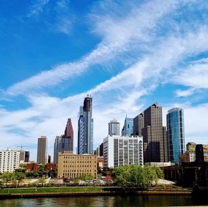 View of skyscrapers against cloudy sky